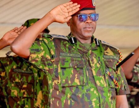 photo of Deputy Inspector General Eliud Langat saluting