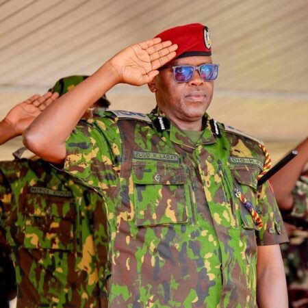 photo of Deputy Inspector General Eliud Langat saluting
