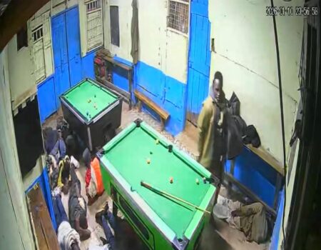 Photo of police officers beating youths playing pool