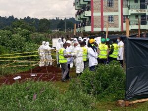 Detectives from the Directorate of criminal investigations homicide department begin exhumation of bodies discovered burried in a mass grave in Kericho